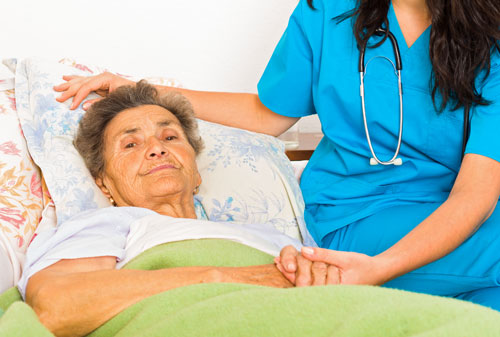 Elderly woman with carer