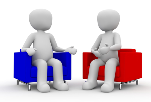 Two people discussing