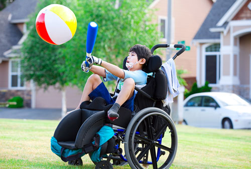 Disabled child playing in park