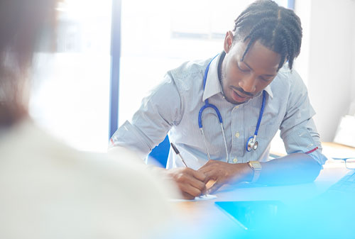 Doctor writing prescription